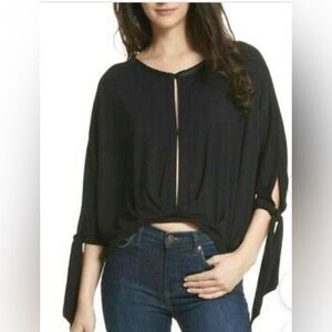 Free People “Keepin On” black twist draped front top. Size XS